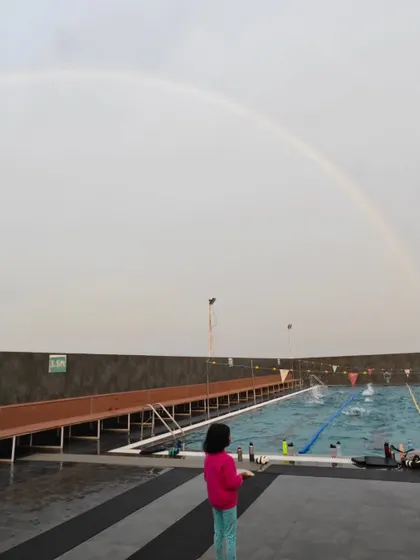A beautiful rainbow arching over our pool after a bit of rain. It's moments like these that make training sessions even more magical.