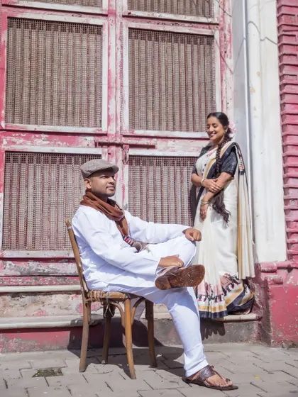 A classic pose from a vintage-inspired pre-wedding session. The architecture and wardrobe come together to transport you to a different era.