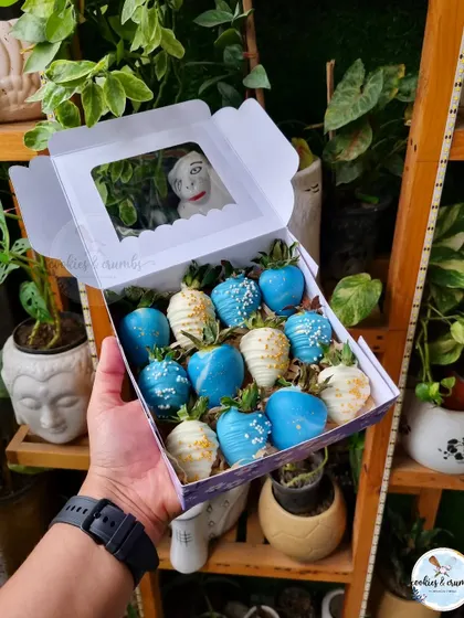A box of beautiful blue and white chocolate-dipped strawberries. I can customize the colors to match any party theme.