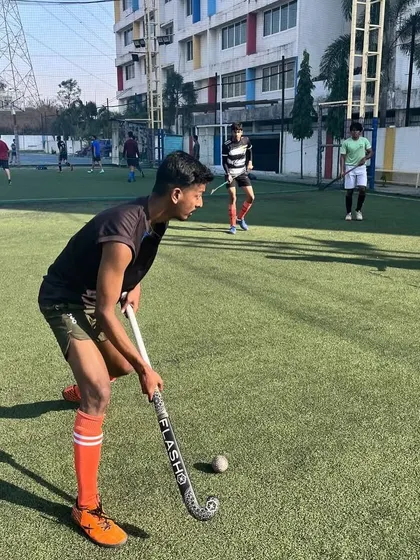 A young player sets up for a pass, demonstrating proper form and technique. We pay close attention to detail to ensure our players develop good habits from the start.