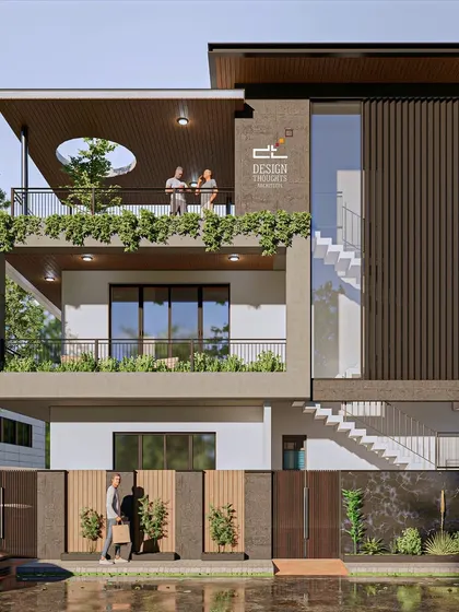 This biophilic contemporary residence is designed to bring nature into every corner. The elevation features deep, cantilevered balconies with lush greenery, an external staircase, and a circular cutout in the roof that creates a unique visual focus.
