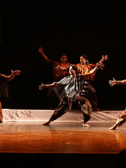 The ensemble cast of 'Antariksha Sanchar' in a moment of dynamic movement. The production tells the story of a young dreamer who builds a flying machine, a tale told through dance, music, and stunning visuals.