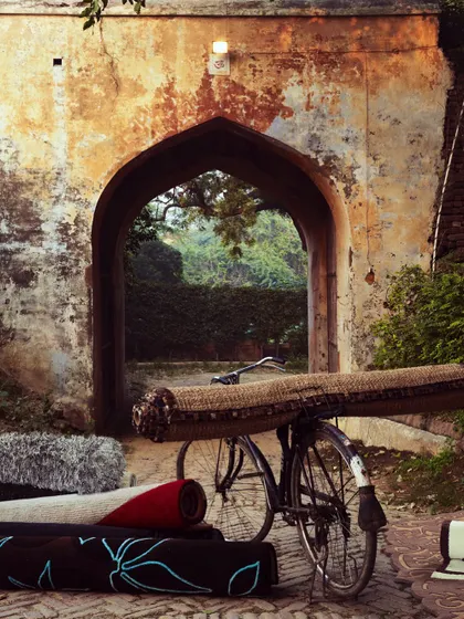 This image was created for a coffee table book, blending the everyday object of a bicycle with the elegance of a handcrafted rug. It’s about finding beauty and story in simple, rustic settings.
