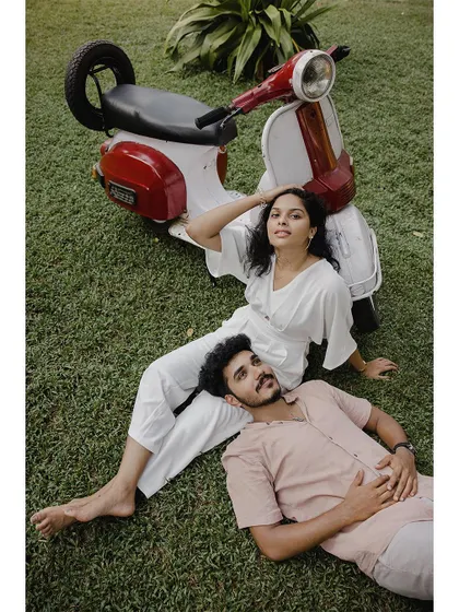 A sweet moment with the groom-to-be resting his head in his partner's lap.