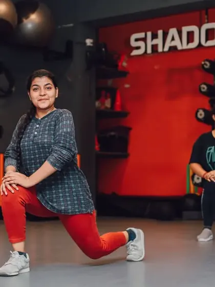 A member performs a lunge during a group class. We create a comfortable and encouraging space for everyone, no matter where they are in their fitness journey.