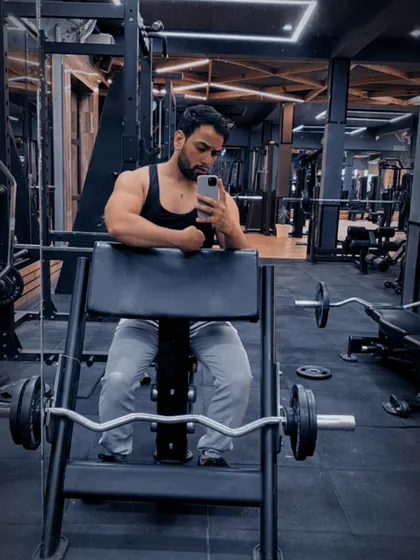 Taking a moment to rest and check my form. Proper technique is just as important as lifting heavy.