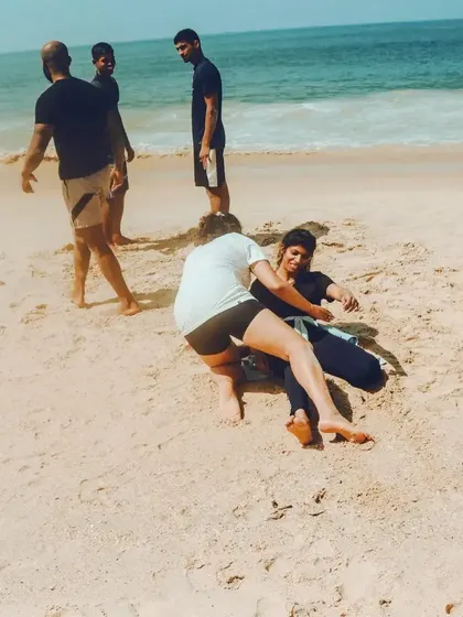 Jiu-Jitsu on the beach is a different beast. Here, two of our members are rolling on the sand, learning to adapt their grappling techniques to an unpredictable surface. This kind of training builds real, functional strength and resilience that you can't find on the mats alone.