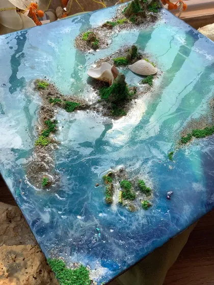 A beautiful ocean-themed resin art piece that was unfortunately damaged by a buyer. This piece shows the depth and texture I can create with resin.