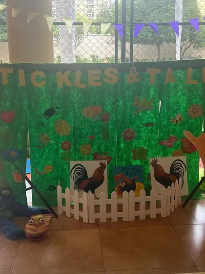My farm-themed setup ready for a birthday party. The big rooster and the white picket fence add a lovely touch to the scene.