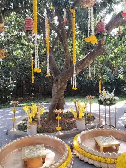 A closer look at the traditional Haldi seating, with intricate floral arrangements and hanging bells, creating a beautiful and sacred space for the ceremony.