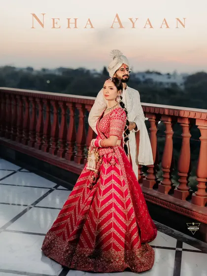 A stunning portrait on a palace balcony at sunset. The warm light, the intricate red lehenga, and the regal pose come together to create a truly royal pre-wedding photograph. This is the kind of timeless image that becomes a family heirloom.