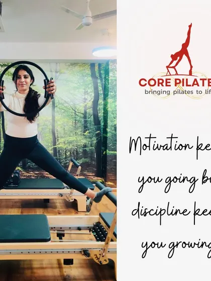 Motivation gets you going, but discipline keeps you growing. A client uses the magic circle on the Reformer to add resistance and focus to her workout.