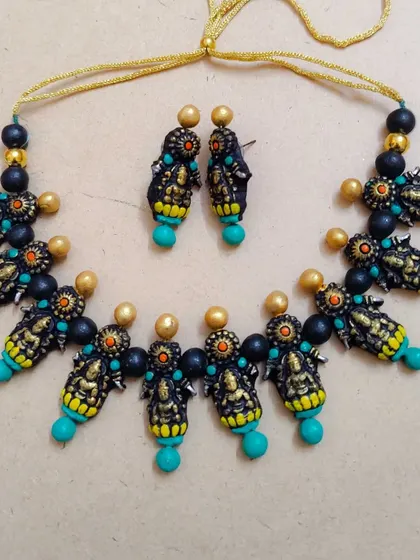 The Mahalakshmi necklace with turquoise beads, a modern and popular color choice for traditional jewelry.