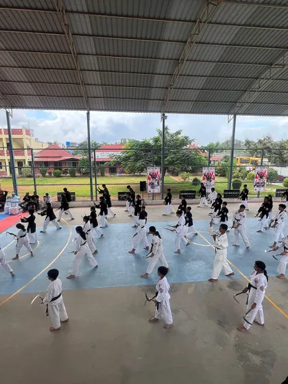 Our versatile covered court transforms to host a wide range of events, including this large-scale martial arts seminar, providing ample space and a professional setup for any discipline.