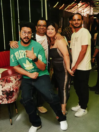 Posing with some cool fans. The energy is always positive.