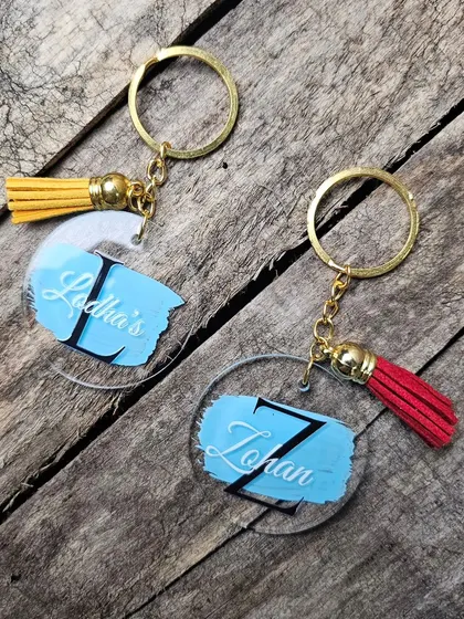 Another angle of the personalized acrylic keychains, showing the clear acrylic base with the custom design.