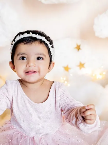 Welcome to dreamland. This "above the clouds" first birthday setup was designed for little Taarika, whose name means star. I love creating these magical scenes at home.