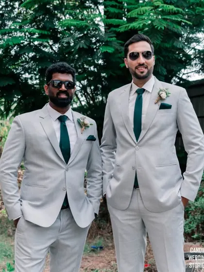 The groom and his best man looking cool and relaxed in their matching suits and sunglasses before the ceremony.