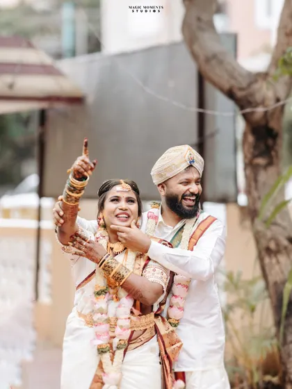 A fun and joyful moment from Sumitha and Navjyoth's wedding day. Their spontaneous laughter and playful pose make for a memorable shot.