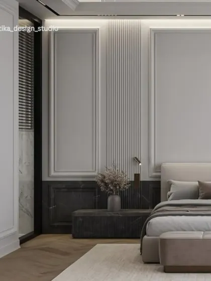 This bedroom exudes quiet luxury with its monochrome palette and rich textures. We used decorative wall molding, fluted panels, and a dark marble accent to create a sophisticated backdrop for the minimalist bed and nightstand.