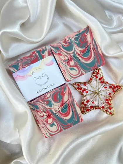 The Yule Tree Magic soap, with swirls of red, green, and white that remind me of a decorated tree.