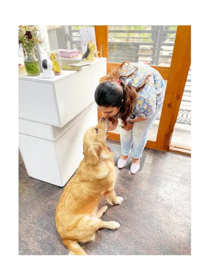 A gentle moment with Elsa the Golden Retriever. Her calm demeanor is a reflection of the safe and loving environment I strive to create.