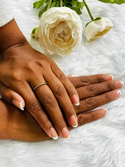 The beauty of simplicity. Here is a classic French manicure on beautifully shaped short, natural nails, offering a clean, timeless, and elegant style for any occasion.