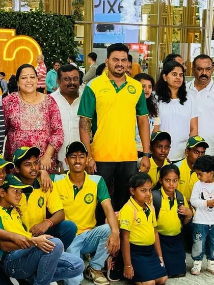 Players and their proud parents pose for a group photo at the airport before the team departs for Sri Lanka.