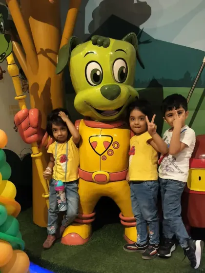 Three young friends pose with our Tinga Dojo statue. Our colorful venue is full of fun photo opportunities for you and your little ones.
