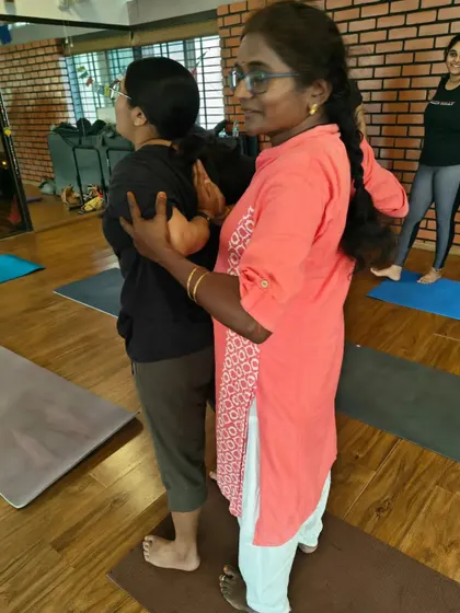 Working together to open the shoulders and chest. This simple partner exercise helps improve posture and release tension that builds up from daily activities like sitting at a desk.