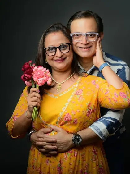 A warm and loving portrait for a 25th-anniversary celebration. The bright colors and close embrace perfectly capture the joy of their long journey together.