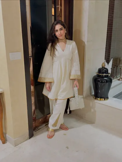 My Rakhi fit check in the self-designed off-white suit. It’s elegant, comfortable, and perfect for a family celebration.
