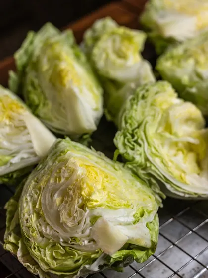 The foundation of a great Caesar salad is perfectly crisp and fresh iceberg lettuce. I source the best produce to ensure every bite is crunchy and refreshing.