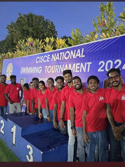 Our dedicated team from Sasthapools Swimming Academy (SSA) posing by the podium after successfully managing the CISCE National swim meet.