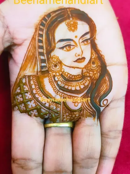 A simple yet beautiful bride portrait on the palm. This is a great option if you want a personal touch without a full-arm design.