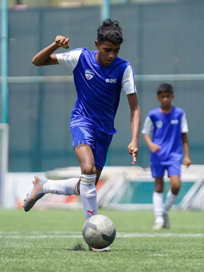 A player prepares to strike the ball with power and precision, a skill developed through countless hours of dedicated practice.
