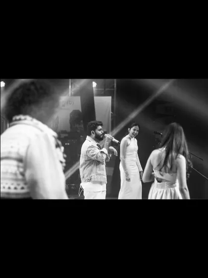 A candid black and white moment on stage with the band at BNMIT Tatva. It's all about the camaraderie and shared love for music.