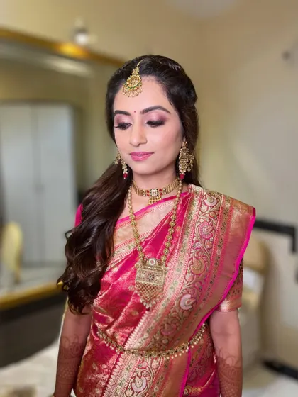 A close-up with eyes closed, highlighting the delicate and shimmery eye makeup.