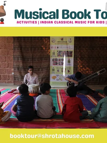 A young audience sits captivated as two student musicians perform on the sitar and tabla. Seeing their peers play is incredibly inspiring for the little ones.