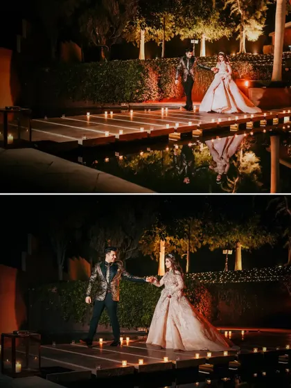 The couple's first dance on a candle-lit bridge over a reflection pool. This cinematic shot captures the magic and romance of a perfectly planned reception moment.