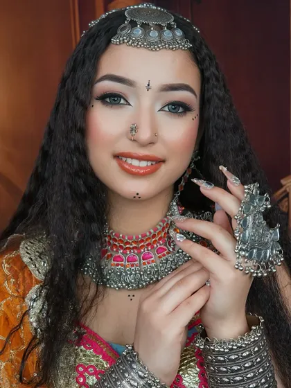 The smile says it all. This shot captures the joy and energy of the festive season, enhanced by our vibrant makeup.
