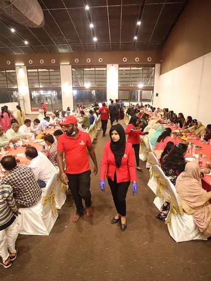 My team in action at the Shukraana party. Our staff, dressed in uniform, are seen serving and managing the event, ensuring everything runs smoothly so you can enjoy your party.