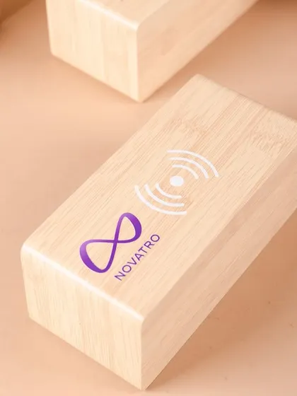 A custom-branded bamboo speaker for Novatro.ai's welcome kit. We love sourcing unique and tech-forward items that align with our clients' brands.