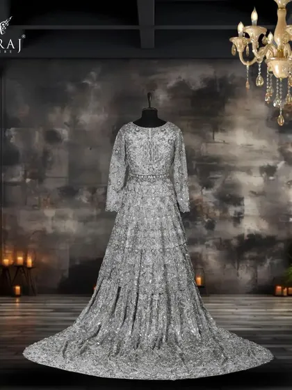 Discover timeless elegance with our Peplum Indo-Western ensemble in a stunning gray metallic hue, adorned with intricate menakari and zardozi work.