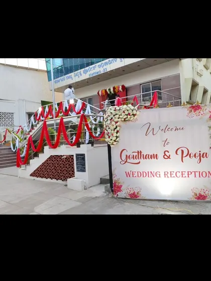 Your guests' first impression matters. We decorated the entire entrance for this wedding reception, including a custom welcome sign and elegantly draped fabric along the staircase to set a celebratory tone from the moment they arrive.