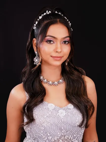 This soft, romantic look with a pearl headband is perfect for an engagement or reception. I teach a range of styles to suit any occasion.