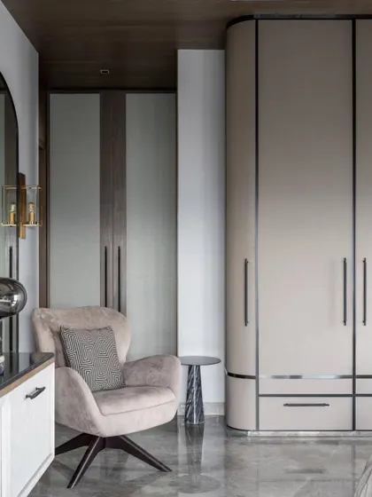 Details of the custom wardrobes in the Skyward Residence. We used leather-clad shutters, curved corners, and integrated lighting to create furniture that feels incredibly bespoke and luxurious.