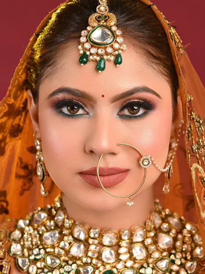 A direct gaze into the camera shows the confidence this makeup gives. The sharp liner and well-defined brows frame the face beautifully.