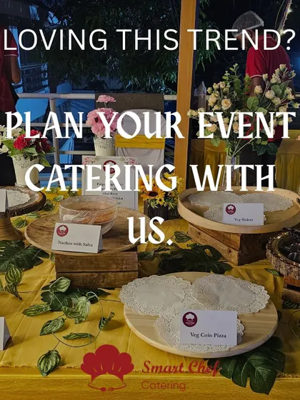 Loving the grazing table trend? Let us plan your next event with a stunning spread like this, featuring mini pizzas, sliders, and a variety of dips and snacks.