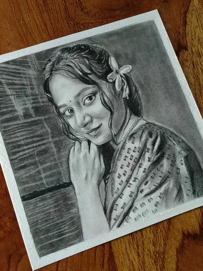 A beautiful portrait of a woman in traditional dress with a flower in her hair, creating a very artistic feel.